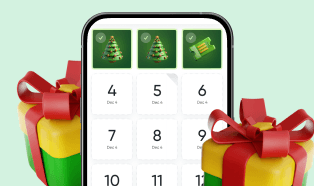 Smartphone mit Adventskalender und Geschenken im Vordergrund