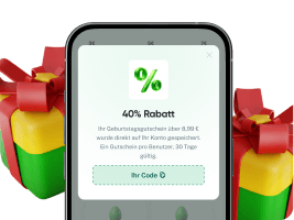 Smartphone with a 40% discount voucher between two red-and-green wrapped gifts