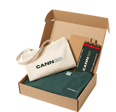 Green CannGo hoodie with a notebook and a ribboned gift box as premium merch